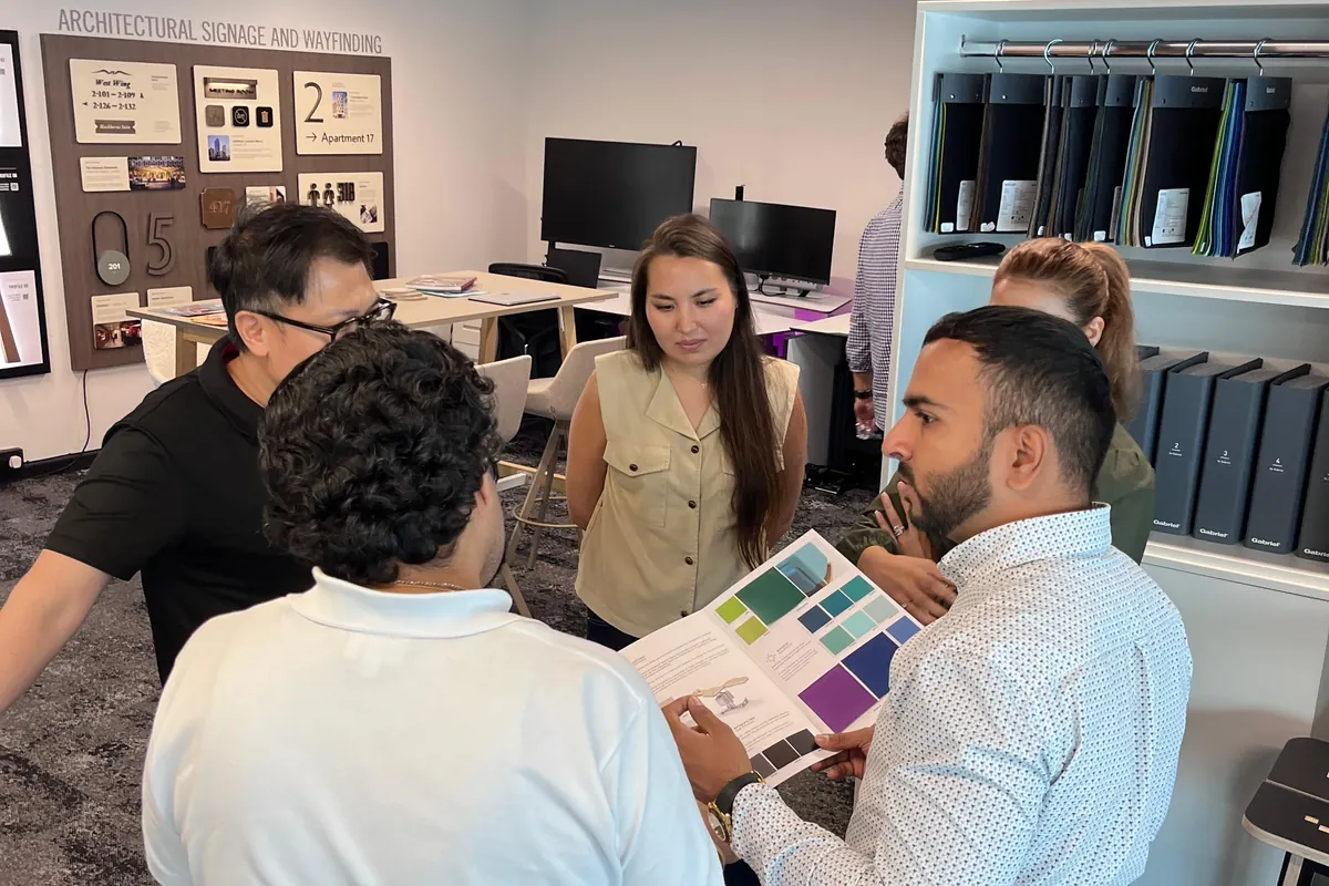 A Repserve team member walking clients through product samples in Studio R, Dubai